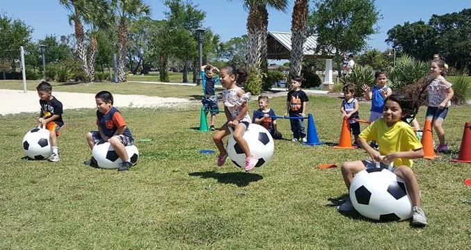 Soccer Hopper Ball Races (Ages 4 12) race to grab their colored bowling pin while bouncing forward on