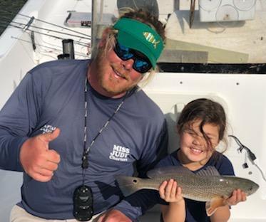 Captain Garrett Ross of Miss Judy Charters and his daughter Stella are having some
