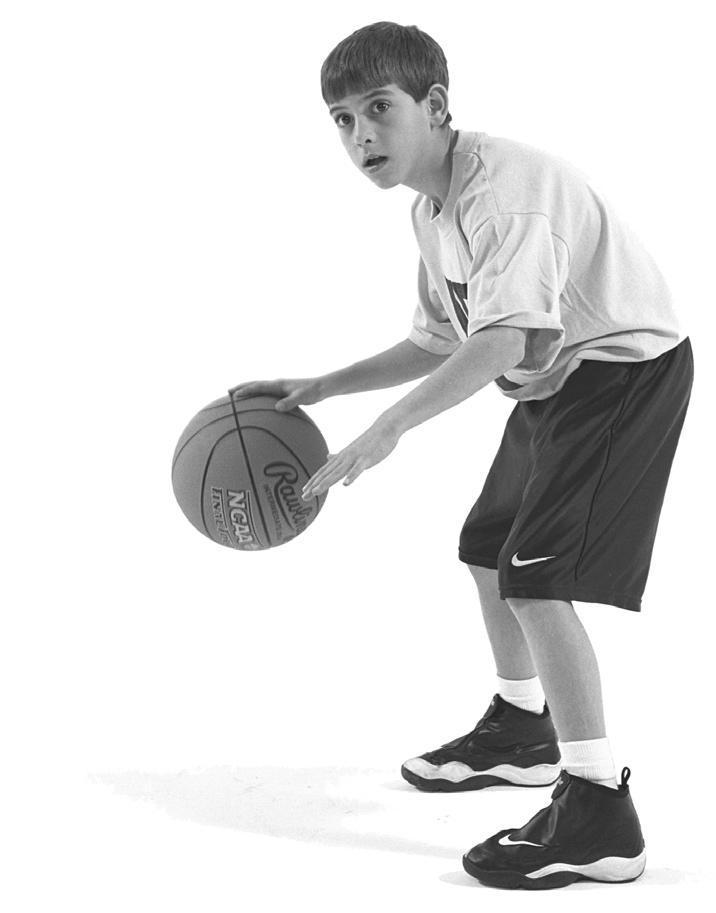 46 Catholic Coaching Basketball Essentials Figure 2.29 Proper dribbling technique. Dribbling Dos and Don ts Dos Keep the dribble alive until you have a shot or an open teammate to pass to.