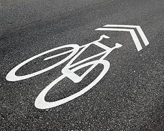 The minimum width for wide curb lanes is fourteen (14) feet. Wide curb lanes improve lateral visibility for bicyclists, resulting in a safer ride.