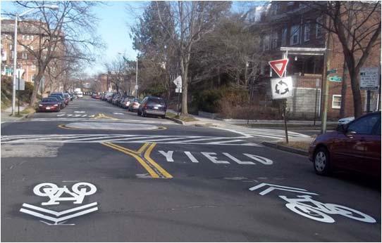 Sharrows, or Shared Lane Markings, accommodate bicyclists on lower volume, lower speed streets without sufficient width for bicycle lanes.