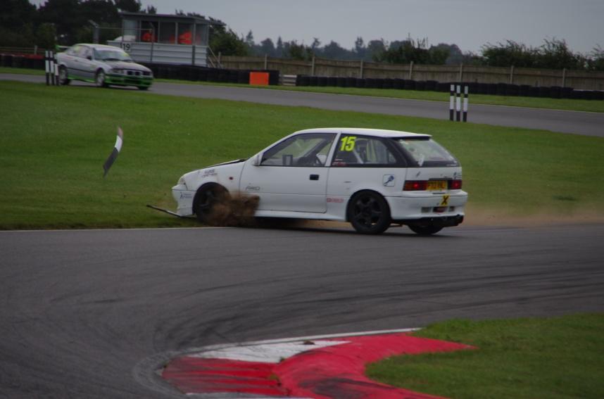 Conditions on track were still variable and entering Murrays a little too fast Matt Hoskings (BAMA) in the Subaru Justy put a wheel on the grass and spun 360 degrees, luckily avoiding all the other