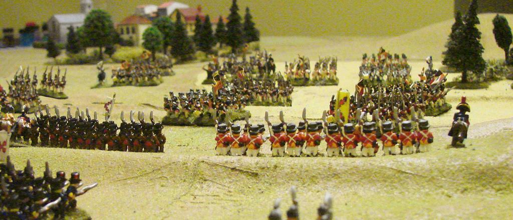 them from tearing up his infantry columns as they advance. The dragoons hit one of the Spanish battalions in line, but are unable to break them.