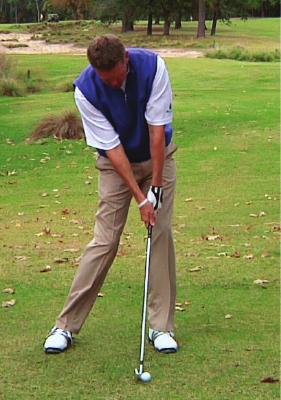 Rotate after contact so the back of the left hand matches up with the clubface. Follow through all the way up to finish.