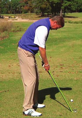 Fix Your Backswing 5 Step 1 Use a tour stick as a guide for your backswing.