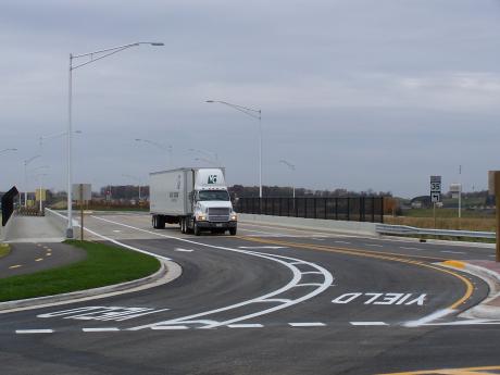 There is an obvious disadvantage with Case 1 in that it may lead to side-swipe collisions between light vehicles and trucks through the roundabout entry.
