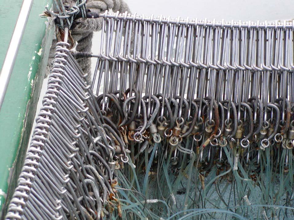 Figure 8 shows the hook bin in detail. Each hook is stored in its longline clip. This bin is rigged with tuna style hooks and a mix of straight monofilament and wire leaders. Figure 8.