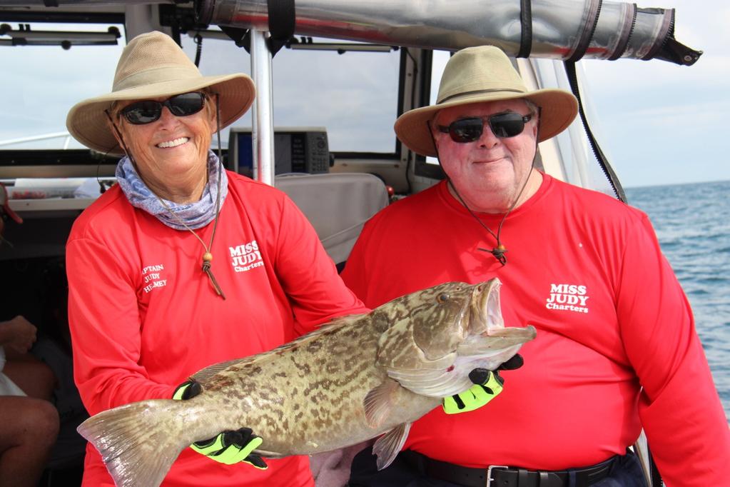 Captain Judy Helmey and Captain Steve Triple Trouble Howell are sporting a grand grouper catching smile!