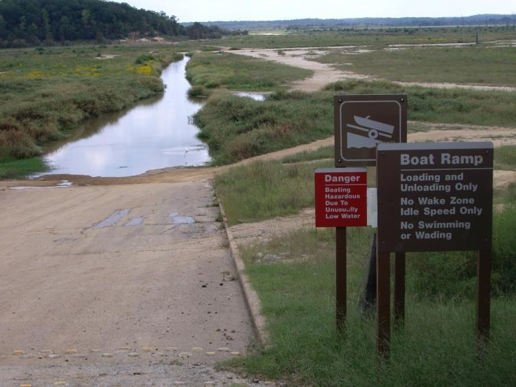 Enid s water level fluctuations sometimes result in low water during the spring spawning season and/or limited natural vegetation colonization.
