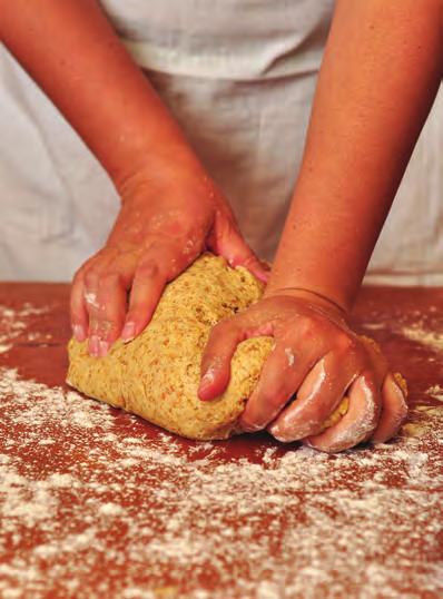 The baker mixes the flour with water, sugar and yeast, turns it into soft, squashy dough and bakes it in a very hot oven.