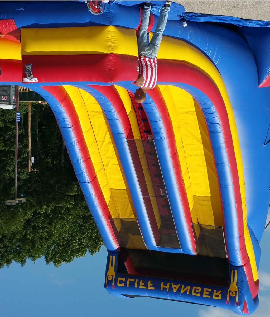27' Cliff Hanger Inflatable Slide Standing almost three stories tall, this two-lane slide is sure to thrill!