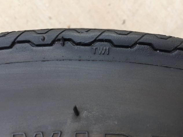 On all the reproduction tires you will see on the sidewall of the