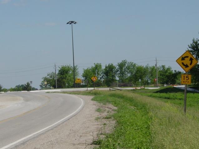 Rural Roundabouts curbing Cross section change alerts driver of upcoming