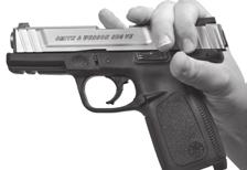 trigger once and remove your finger from the trigger and out of the trigger guard (FIGURE 23).