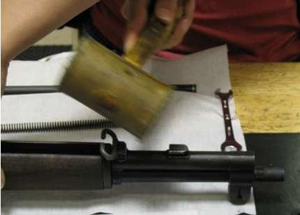8) Remove the front handguard by sliding it forward over