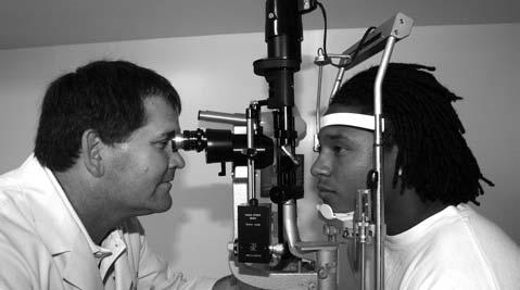Don Peavy conducts eye exams for s student-athletes in a convenient location