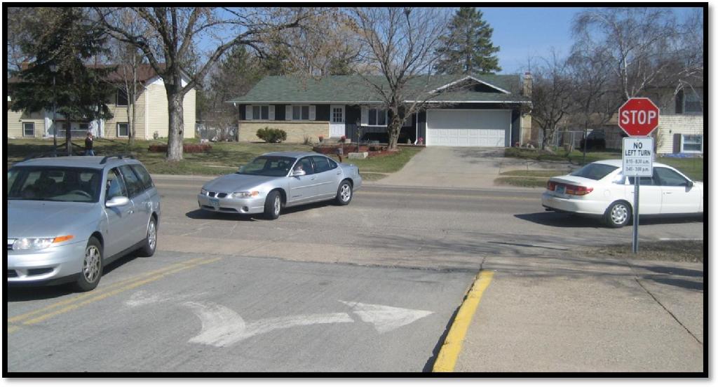 Signed left-turn restriction at the Southview driveway onto Garden View Drive.