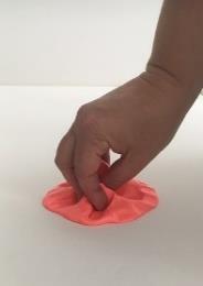Roll the putty forwards and backwards (arms and hands moving only, do not