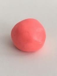 Place the putty on a table/smooth surface and roll the putty into a large