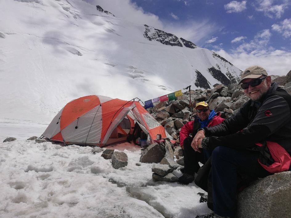Figure 4: Ralph (left) and Keith at ABC at 5820m with a view of the north-face of Rhondo I [Photo: Tsewang Gyalson]. 22 nd July: planned as our ascent day.