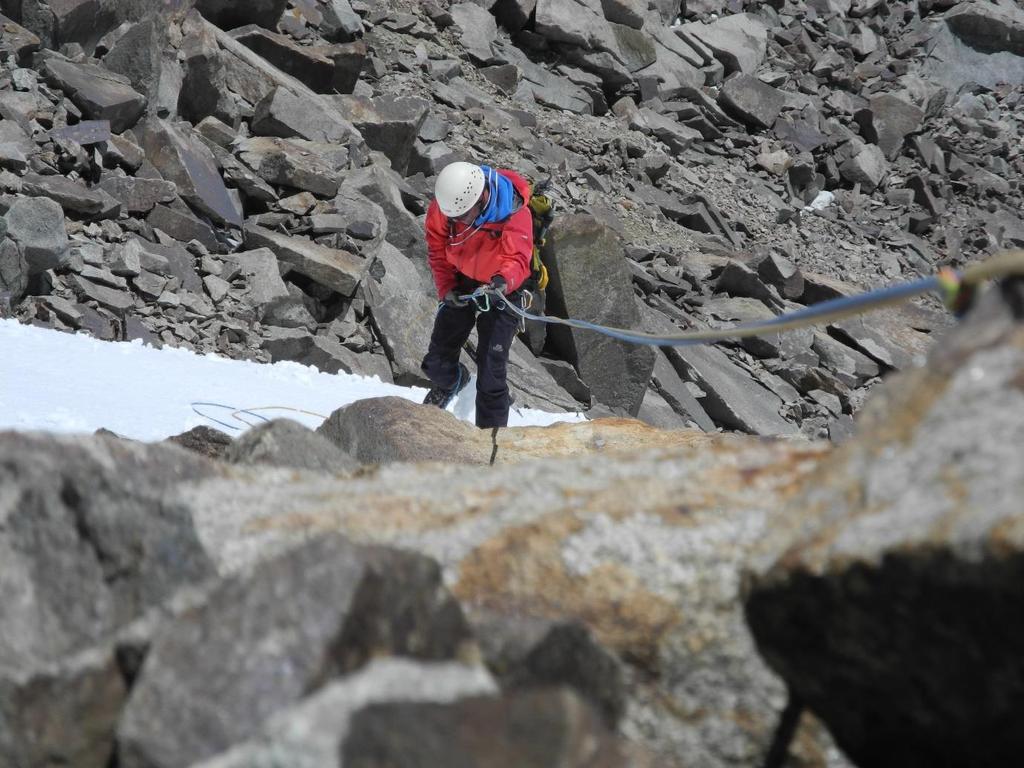 Figure 8: Ralph abseiling on the difficult descent [Photo: Keith Goffin].