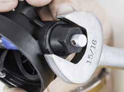 10) Using a 5/8 inch wrench, loosen the end cap packing nut, but leave it in place.
