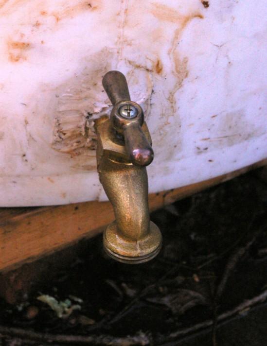 Tightly wrap the threaded end of the spigot with pipe tape and screw