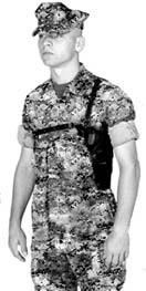 The ammunition pocket attaches to the chest strap directly underneath the right arm. Figure 1-15. M7 Shoulder Holster. Assault Holster Some Marines (i.e., Marine security force, direct action platoon, and military police) are required to carry the assault holster.
