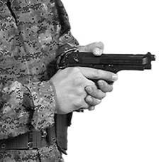 Point the pistol in a safe direction and grasp the pistol grip with the right hand. Figure 2-1. Checking the Round Indicator. Place the trigger guard in the palm of the left hand.