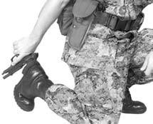 Figure 8-10. Rack Slide Against Heel of Boot. Apply pressure on the pistol to keep the rear sight secured while pushing downward on the pistol to move the slide fully to the rear.