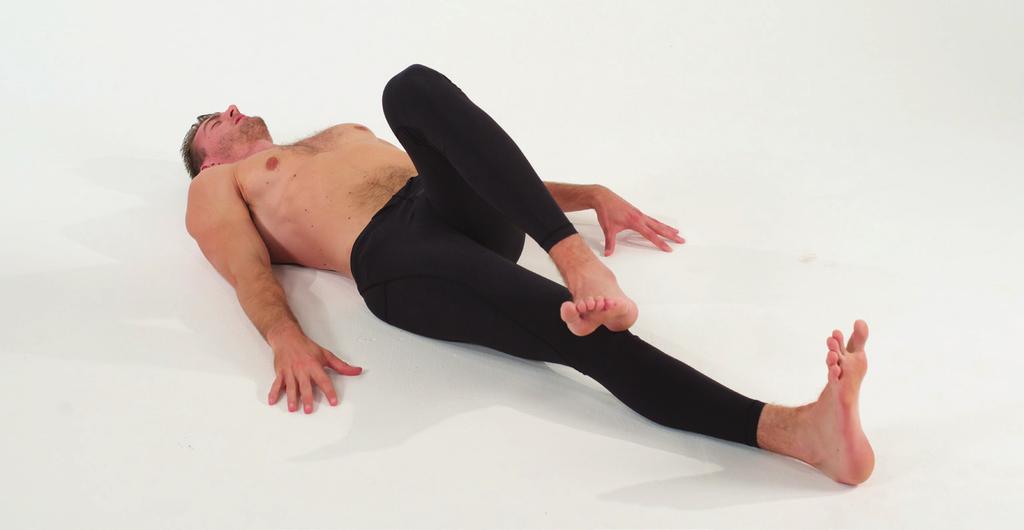 INTERNAL LEG TRACING 8 Lift your left leg up, internally rotate at the hip so that your knee and toes point across the midline of your body. 1 Set up as if you re doing Supine Decompression.
