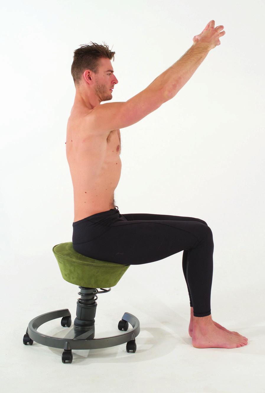 SEATED DECOMPRESSION 1 Slide toward the end of your chair and sit as tall as you can. Bring the ankles directly under the front of your knees and squeeze your feet and knees together.