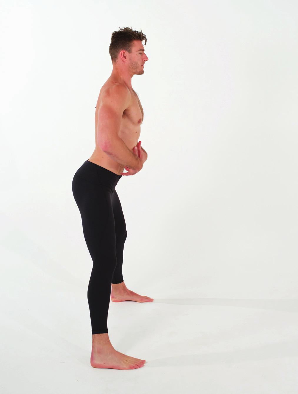 FOUNDER TM 1 Stand with your legs wider than shoulder width and the outside edges of the feet parallel to each other.