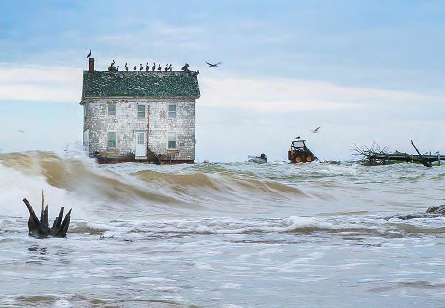 In this photograph, the last house on Holland Island was still standing in 2010 it collapsed into the Chesapeake Bay, a victim of sea level rise and erosion.