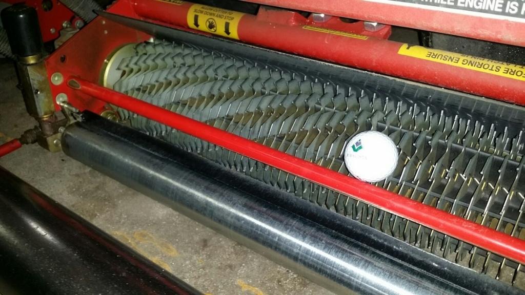 125-0.25 apart. The picture below shows a close up of the cutting unit. The golf ball gives you a size reference.