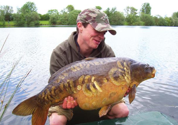 BEN GRATWICKE the issue Tom Downe with a nice scaley mirror from Hardwick Lake on the Linear complex in Oxford. A proper fish from a well-managed lake.