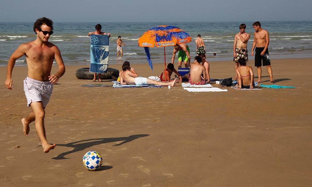 Holidaymakers enjoy the sunshine on the former D-Day landing zone