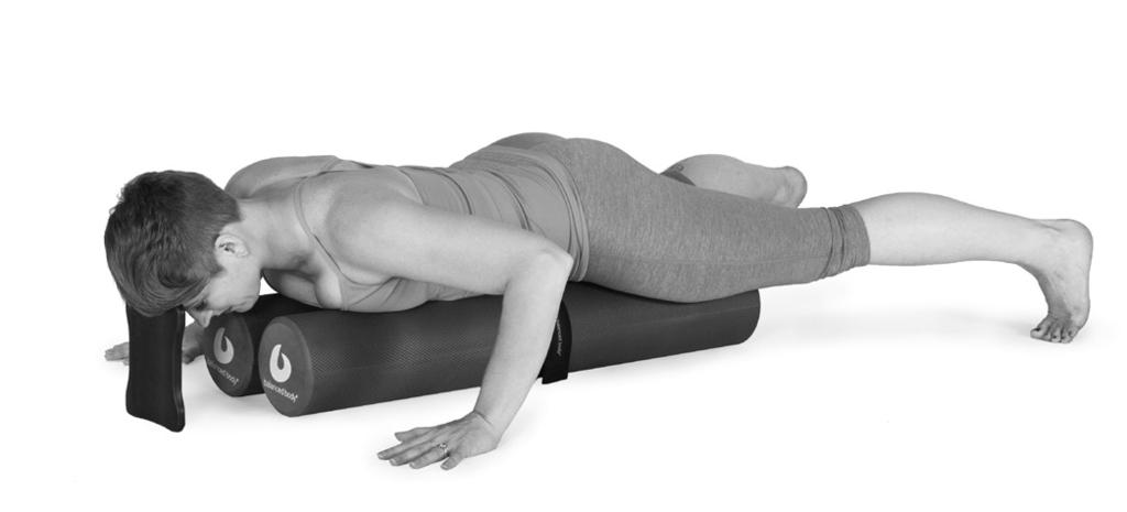 B. SWAN Lie prone with chest, hips and thighs on rollers. Knees are off the edge of rollers, feet are dorsi-flexed.