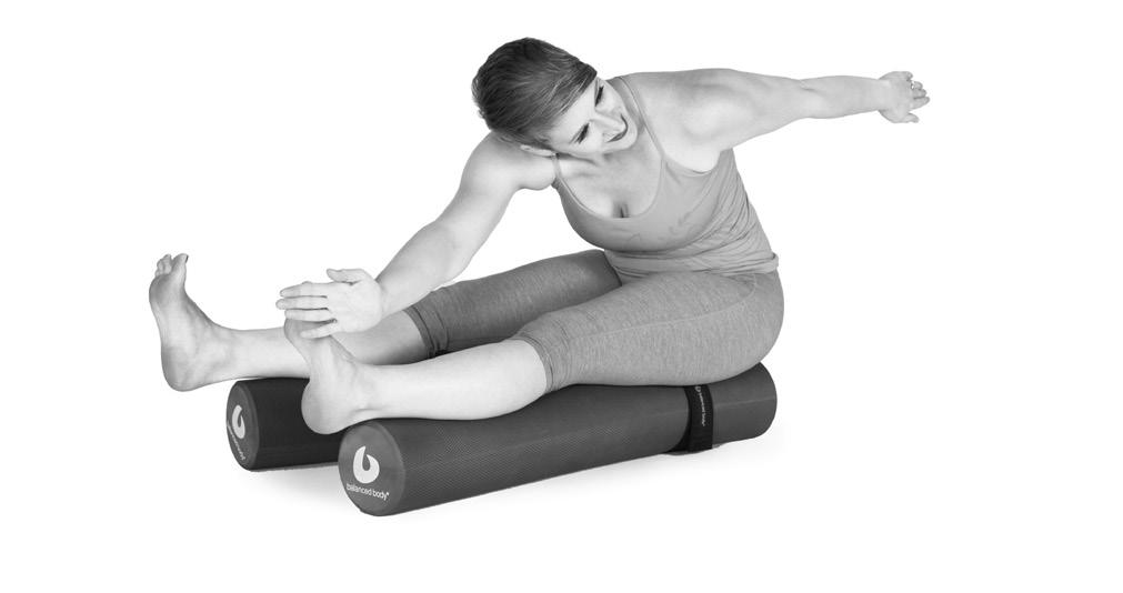 B. SAW Seated on top of the rollers with legs apart in a V, pressing into rollers and arms in a T position.