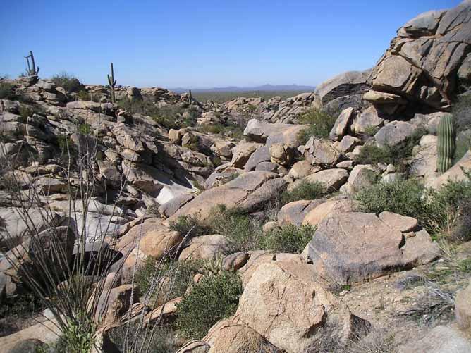 96 Ranch Pinal County, Arizona (1) Granite boulder outcroppings on the deeded land. Offered for sale exclusively by: Paul Groseta Headquarters West, Ltd.