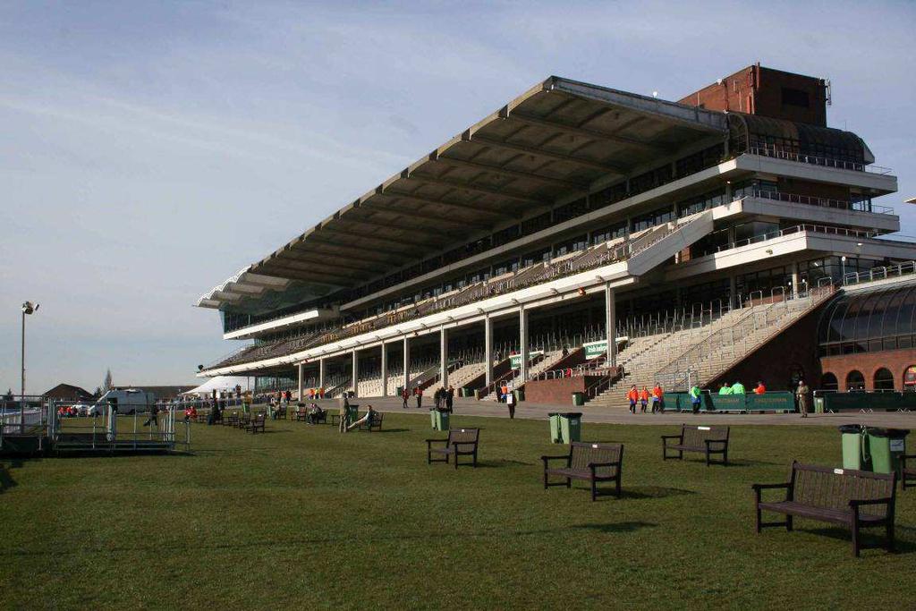 large number of separate buildings - not only the grandstand itself but loads of buildings behind the stands.