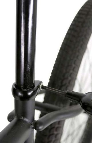 seatpost. Tighten anywhere on the seatpost that is of uniform diameter.