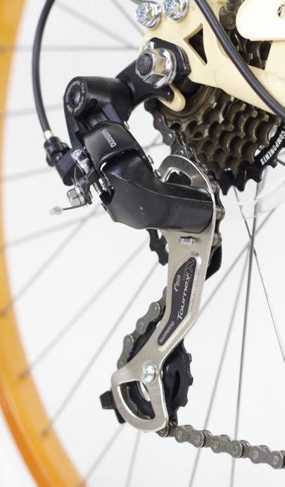 Rotate pedals until the chain falls into the smallest cog.