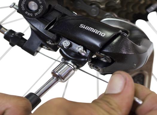 05 9MM MULTI-TOOL Now adjust the cable tension, which controls how your bike will shift. Using a 9mm crescent wrench or the multi-tool, loosen the cable adjustment screw and pull on the cable.