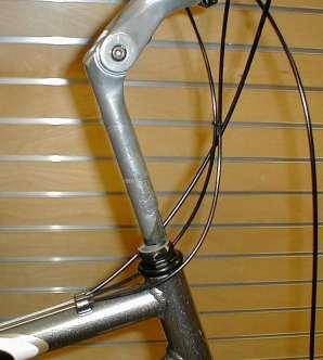 Note direction of springs Correctly installed skewer Correct quick-release tensioning: 1. Turn the lever to the open position so that the curved part faces away from the bicycle. 2.