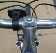 To install a handlebar-mounted front reflector (white), remove the reflector mounting screw and gently open the bracket enough to slide over the handlebar on the left side of the stem.