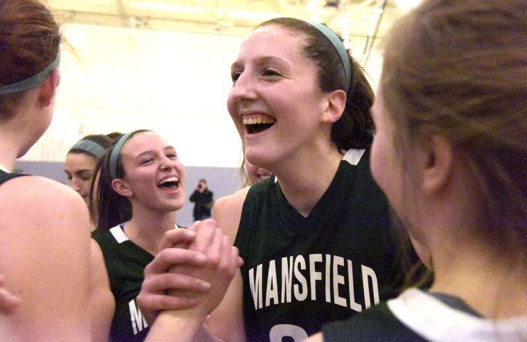 Hill reaches 1,000 as Mansfield clinches title share By Mark Farinella Mansfield's Megan Hill is greeted by her teammates after scoring her 1000th point.