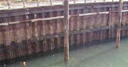 Each sheet pile interlocks with adjacent sheet piles to form a rigid sheet pile wall and retain an