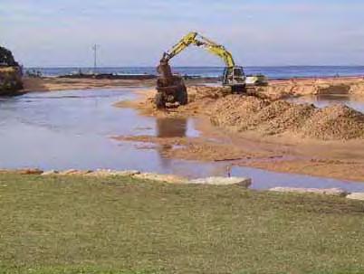 Dredging: Dredging is the removal or displacement of sand, silt, gravel, or other submerged materials from the bottom of water bodies, riparian watercourses, or natural wetlands.