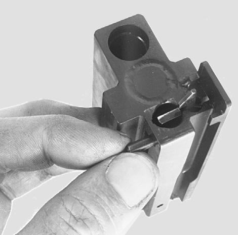 To do this, push the locking catch to the right (Fig. 27). Prevent the firing pin assembly with firing pin spring from springing out with your thumb. locking catch Fig. 26 Fig.